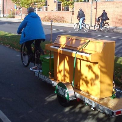 Move By Bike moving a piano on a 64AWD bicycle trailer