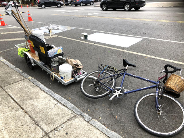 photo of railer parked next to curb