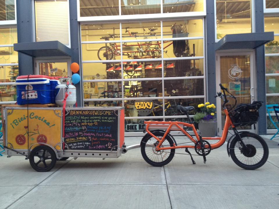 bicicocina trailer with an electric bike in front of Boxy Bikes