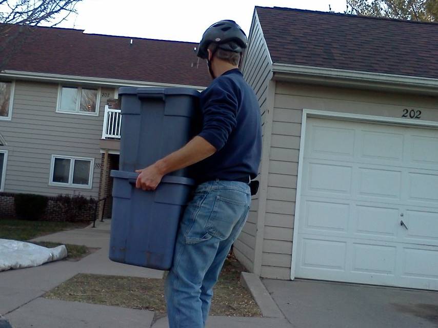 carrying four bags of groceries inside two containers