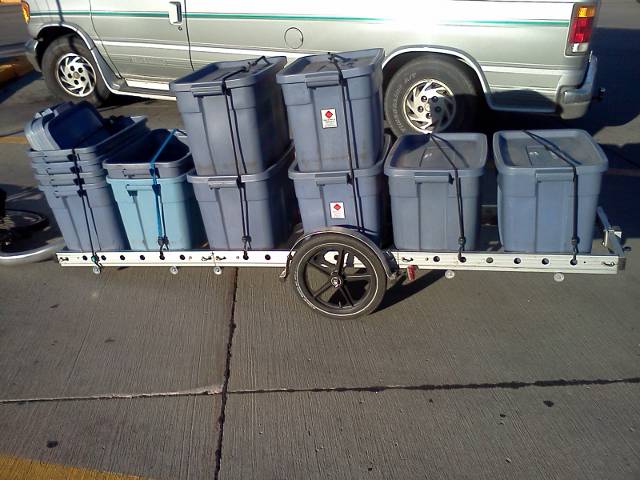 eleven bags of groceries loaded into six containers on the trailer