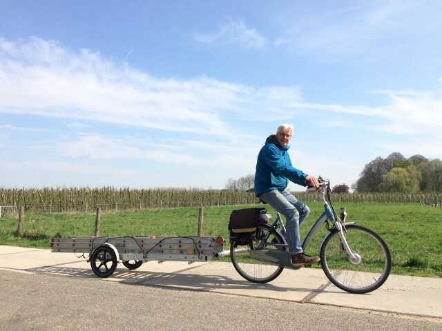 photo of Dieter carrying a ladder on cycle path