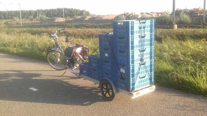 photo of large stack of eurocrates on trailer