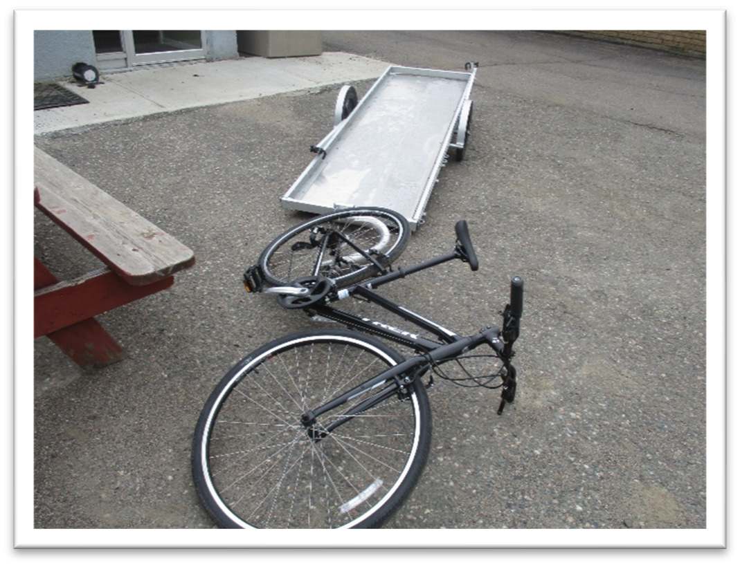 empty trailer and bike showing how bike can be laid on it side for loading and unloading