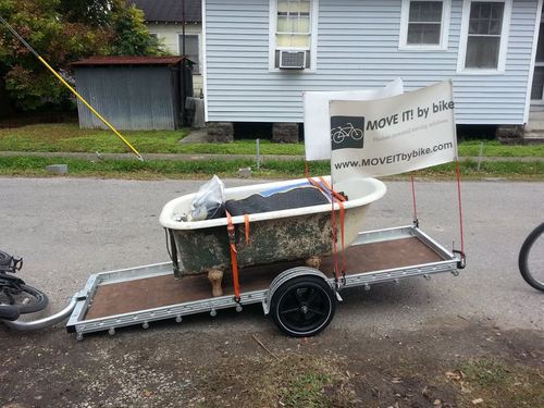 Move It By Bike carrying a cast iron bathtub