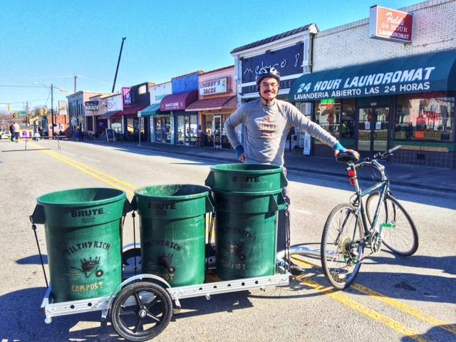 Tilthy Rich trailer with large bins in downtown Durham