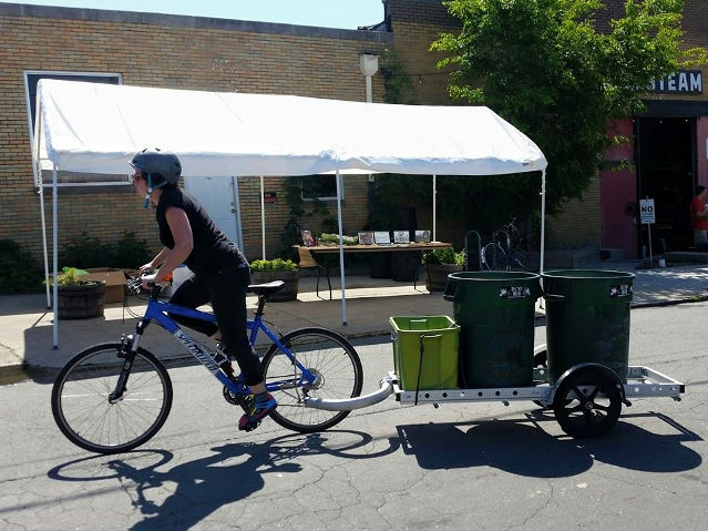 Tilthy Rich rider and trailer in front of display
