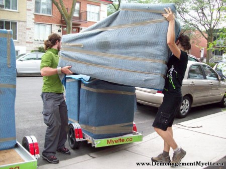 two Déménagement Myette employees loading furniture