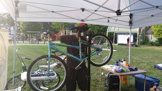 photo of  mechanic working on bicycle at event