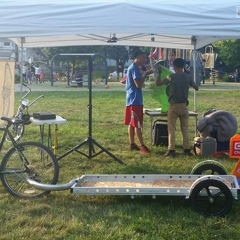 photo of empty bicycle trailer in front of canopy prior to event