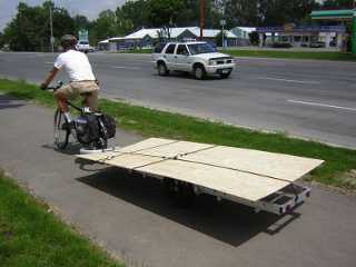 96B trailer carrying plywood sheet on fenders