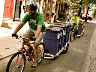 two 64A bicycle trailers being used by Wash Cycle Laundry