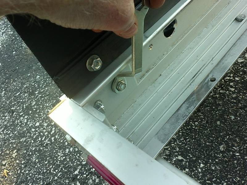 locknut on end of U-bolt inside the trailer frame